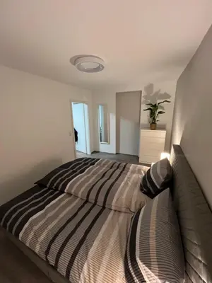 Ein Bett oder Betten in einem Zimmer der Unterkunft Ferienwohnung zum Kriegerdenkmal