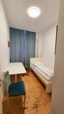 Ein Bett oder Betten in einem Zimmer der Unterkunft Zimmer im Erdgeschoss