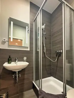 Ein Badezimmer in der Unterkunft HAVENU Hotel Quartier 8