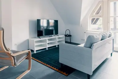 TV/Unterhaltungsangebot in der Unterkunft Moderne 2 Zimmer Wohnung im Herzen von Karlsruhe 64m2 2 OG