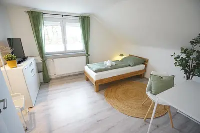 Ein Bett oder Betten in einem Zimmer der Unterkunft Sonnenhöhe Apartment