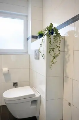 Ein Badezimmer in der Unterkunft STN Kocherwald Suite - Ferienwohnung mit 4 Schlafzimmer, 8 Big Beds, Parkplatz & Balkon, Highspeed WLAN, Netflix Premium, Zentral zu Audi & Schwarz Gruppe