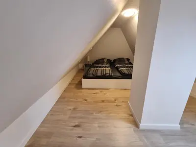 Ein Bett oder Betten in einem Zimmer der Unterkunft Ferienwohnung Heppenheim an der Bergstraße WHG 4