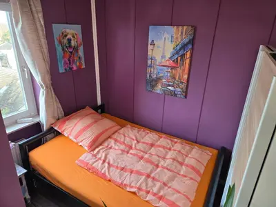 Ein Bett oder Betten in einem Zimmer der Unterkunft Ferienwohnung Nähe Flughafen