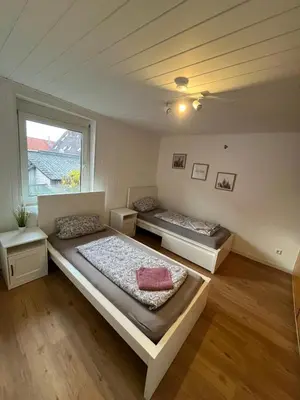 Ein Bett oder Betten in einem Zimmer der Unterkunft Moderne Ferienwohnung zentral in Hemsbach