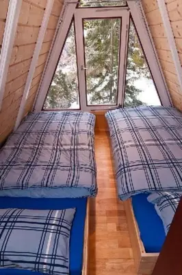 Ein Bett oder Betten in einem Zimmer der Unterkunft Holiday Home Nur-Dach-Ferienhaus für vier Personen by Interhome