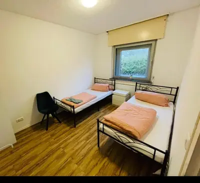 Ein Bett oder Betten in einem Zimmer der Unterkunft House A44