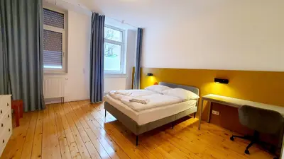 Ein Bett oder Betten in einem Zimmer der Unterkunft Zimmer im Erdgeschoss II