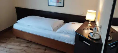 Ein Bett oder Betten in einem Zimmer der Unterkunft Hotel am Theater