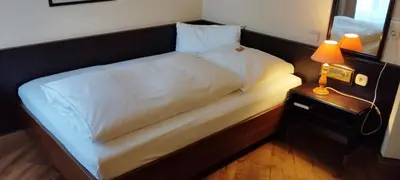 Ein Bett oder Betten in einem Zimmer der Unterkunft Hotel am Theater
