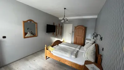 Ein Bett oder Betten in einem Zimmer der Unterkunft Weingut Günther und Gästezimmer