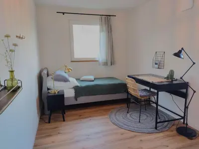 Ein Bett oder Betten in einem Zimmer der Unterkunft Ferienhaus Maias Muthof