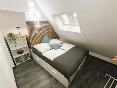 Ein Bett oder Betten in einem Zimmer der Unterkunft FeWo D&Y -barrierefrei-