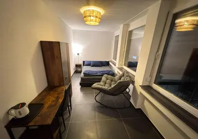 Ein Bett oder Betten in einem Zimmer der Unterkunft Hotelikum zentreal Bequem