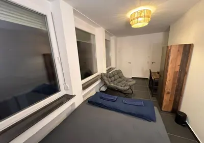 Ein Bett oder Betten in einem Zimmer der Unterkunft Hotelikum zentreal Bequem