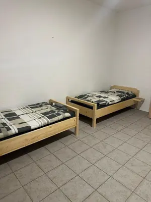 Ein Bett oder Betten in einem Zimmer der Unterkunft Monteurunterkunft in ruhiger Lage, nahe Zentrum