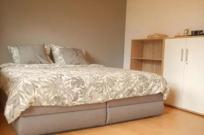 Ein Bett oder Betten in einem Zimmer der Unterkunft Pension am Waldrand