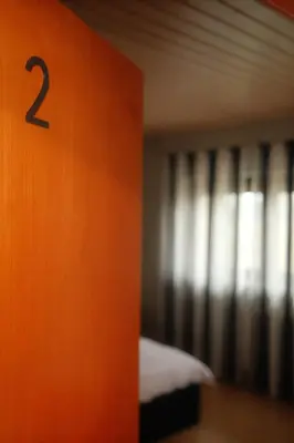Ein Bett oder Betten in einem Zimmer der Unterkunft Pension am Waldrand