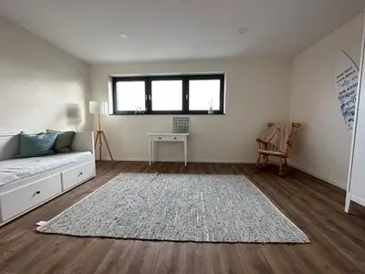 Ein Sitzbereich in der Unterkunft Neue helle 4 Zimmerwohnung mit Tiefgaragenparkplatz