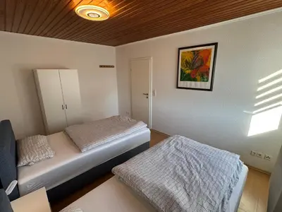 Ein Bett oder Betten in einem Zimmer der Unterkunft Gemütliche, lichtdurchflutete Wohnung