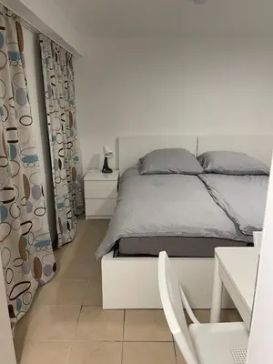 Ein Bett oder Betten in einem Zimmer der Unterkunft Haus zum Bacchus Privatezimmer near Bahnhof Römisches Theater Mainz