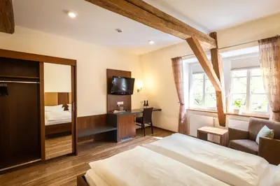 Ein Bett oder Betten in einem Zimmer der Unterkunft Altstadthof Freinsheim