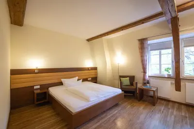 Ein Bett oder Betten in einem Zimmer der Unterkunft Altstadthof Freinsheim
