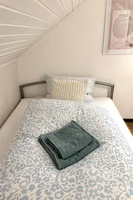 Ein Bett oder Betten in einem Zimmer der Unterkunft Domus Palatina FeWo & Business Apartments