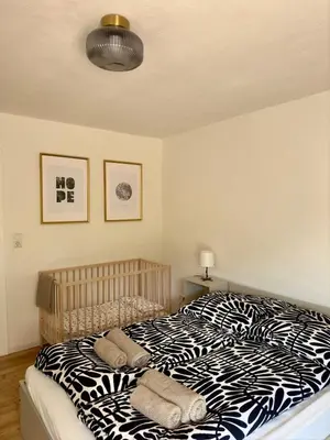 Ein Bett oder Betten in einem Zimmer der Unterkunft Cozy apartment with a Black Forest view
