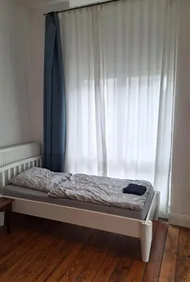 Ein Bett oder Betten in einem Zimmer der Unterkunft Groundfloor Monteurswohnung