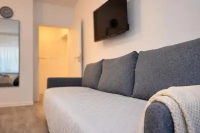 TV/Unterhaltungsangebot in der Unterkunft Modern City Apartment Pforzheim frieden apartments