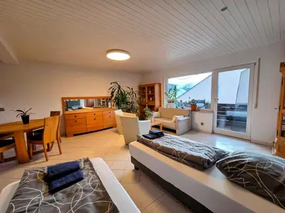 Ein Bett oder Betten in einem Zimmer der Unterkunft Geräumige Wohnung mit 4 Betten und Balkon