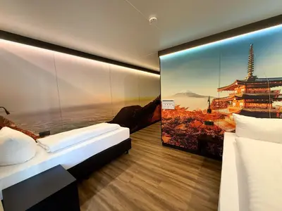 Ein Bett oder Betten in einem Zimmer der Unterkunft ILS Hotel by WMM Hotels