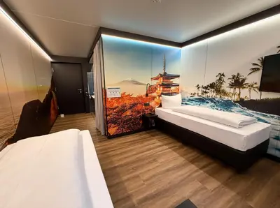 Ein Bett oder Betten in einem Zimmer der Unterkunft ILS Hotel by WMM Hotels