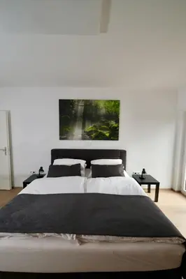 Ein Bett oder Betten in einem Zimmer der Unterkunft Ferienhaus für Familien und Reisegruppen bei Heidelberg