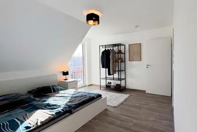 Ein Bett oder Betten in einem Zimmer der Unterkunft Modernes 118qm Haus für Ferien und Arbeit