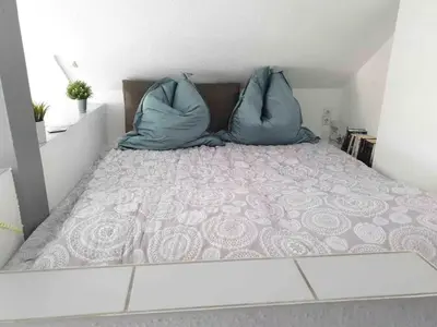Ein Bett oder Betten in einem Zimmer der Unterkunft Loft mit Kaminofen - Karlsdorf