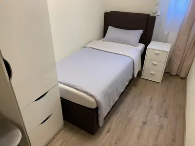 Ein Bett oder Betten in einem Zimmer der Unterkunft Große Ferienwohnung mit Balkon in Sankt Martin, Pfalz