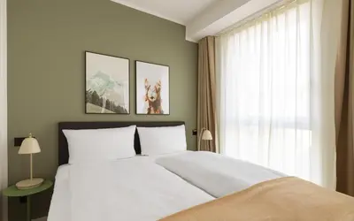 Ein Bett oder Betten in einem Zimmer der Unterkunft Limehome Mannheim City Center
