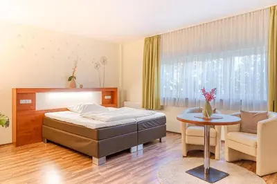Ein Bett oder Betten in einem Zimmer der Unterkunft Hotel Victoria