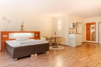 Ein Bett oder Betten in einem Zimmer der Unterkunft Hotel Victoria
