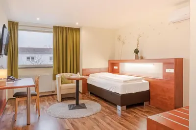 Ein Bett oder Betten in einem Zimmer der Unterkunft Hotel Victoria