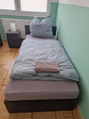Ein Bett oder Betten in einem Zimmer der Unterkunft Wolfskraft