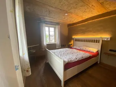 Ein Bett oder Betten in einem Zimmer der Unterkunft Öko-Fachwerkhaus am Schwarzwald