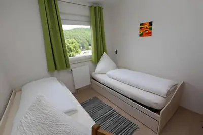 Ein Bett oder Betten in einem Zimmer der Unterkunft Ferienwohnungen Weber