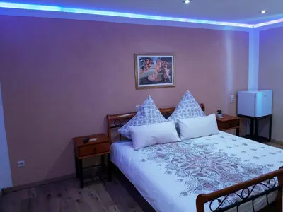 Ein Bett oder Betten in einem Zimmer der Unterkunft Gäste Zimmer-Ristorante Kochertal da Enzo