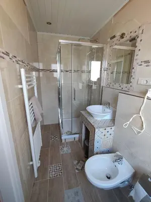 Ein Badezimmer in der Unterkunft Gäste Zimmer-Ristorante Kochertal da Enzo