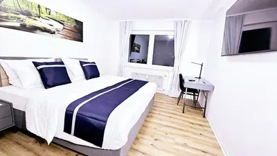 Ein Bett oder Betten in einem Zimmer der Unterkunft Ioana Homes Ferienwohnung
