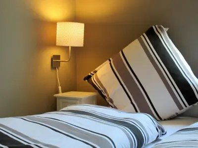 Ein Bett oder Betten in einem Zimmer der Unterkunft Ferienwohnungen Neckarblick - Heidelberg Altstadt