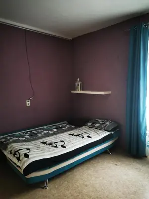 Ein Bett oder Betten in einem Zimmer der Unterkunft Stadtmitte Ferienwohnung